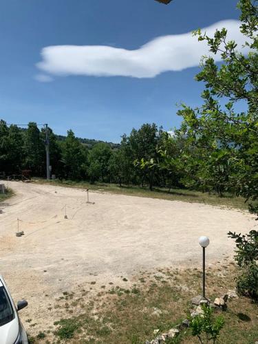 a large parking lot with a baseball field at Terrae Eremis: Ristorante, Bar, B&B in Roccamorice