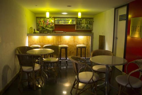a room with tables and chairs in a restaurant at Hotel Dan Inn Mar Piedade - Grande Recife By Nacional Inn in Recife