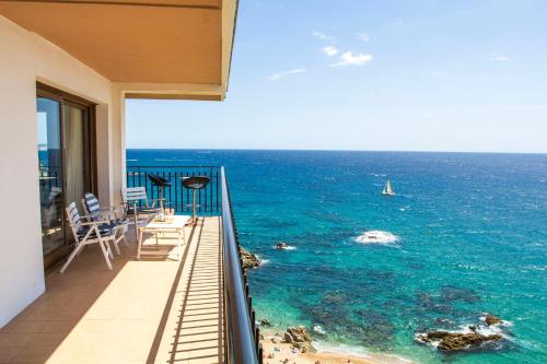 a balcony with a view of the ocean at Spacious seafront apartment in Platja d'Aro