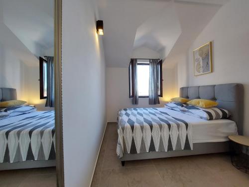 Cama o camas de una habitación en Apartments Lavanda - free parking and grill