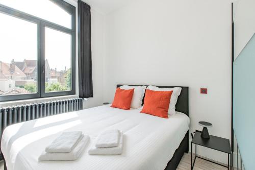 Un pat sau paturi într-o cameră la Ribas Guestrooms