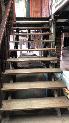 a group of wooden stairs in a room at SolarCell walking street Homestay - โซล่าเซลล์ถนนคนเดินโฮมสเตย์ in Ban Nong Nam Khan