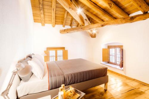 Postel nebo postele na pokoji v ubytování Alp Apartments SKI & BIKE - Xavier