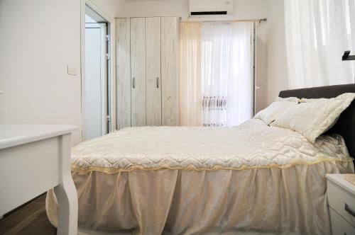 Postel nebo postele na pokoji v ubytování Apartments Villa Stankovic