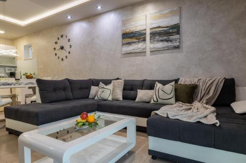 a living room with a couch and a table at Apartments Niko in Makarska
