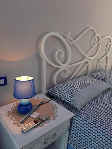Letto o letti in una camera di Santa Margherita Suite - CHIAIOLELLA