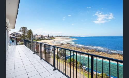 a balcony with a view of the ocean at Beachfront Penthouse at The Entrance in The Entrance