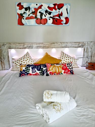 a white bed with two towels on top of it at Gran Calahonda Beach near Marbella in Málaga