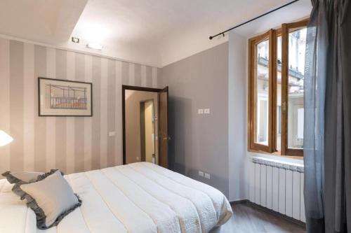 A bed or beds in a room at Guelfa Dream