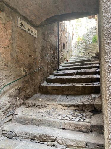 a group of stone stairs in a stone building at Villa Verde in Valsolda