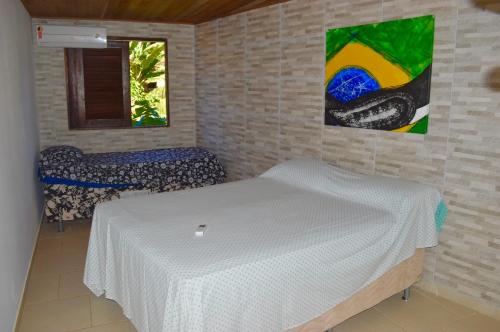 Ένα ή περισσότερα κρεβάτια σε δωμάτιο στο Casa do Frá