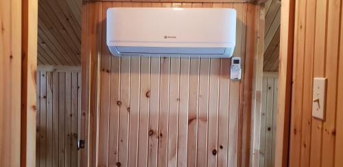 a water heater on the wall of a sauna at Pourvoirie Stéphane Marin in Maskinongé