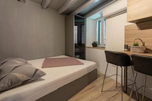 Ένα ή περισσότερα κρεβάτια σε δωμάτιο στο Guest House Blue