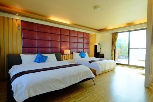 Giường trong phòng chung tại Yudo B&B Yilan