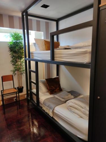 Postel nebo postele na pokoji v ubytování Caruma Surf Hostel