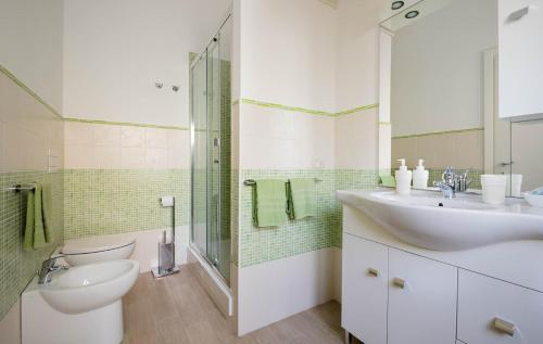 a bathroom with a sink and a toilet and a shower at Casa di Nora in Formia