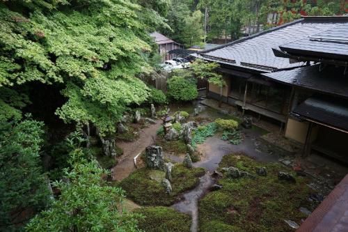 an aerial view of a garden with rocks and trees at Koyasan Shukubo Saizenin in Koyasan
