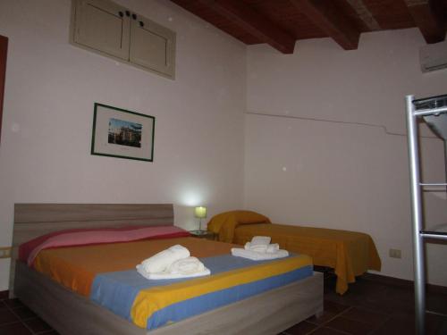 Postel nebo postele na pokoji v ubytování Zurigo Val di Noto