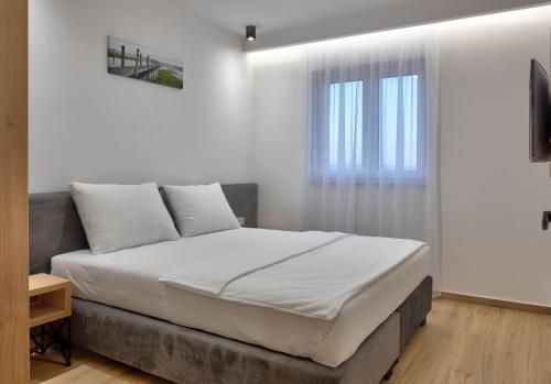 Кровать или кровати в номере Apartments Amare