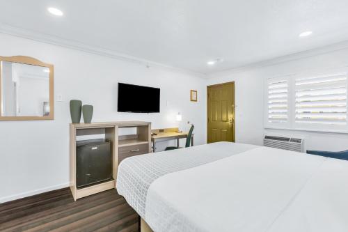 Katil atau katil-katil dalam bilik di Napa Valley Hotel & Suites