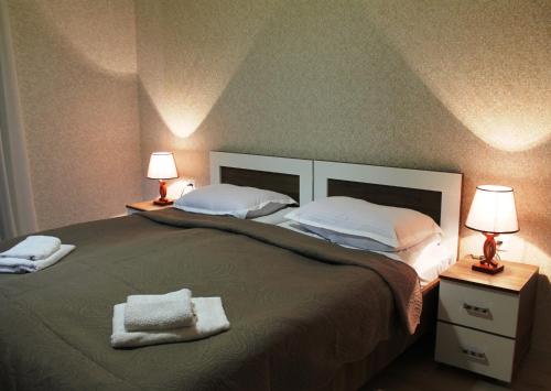 Postel nebo postele na pokoji v ubytování Hotel Marliza
