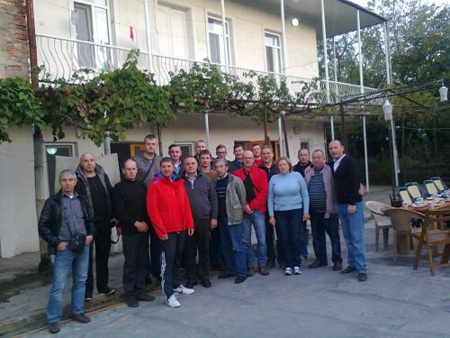 a group of people standing in front of a building at Giorgi's Homestay in Kutaisi