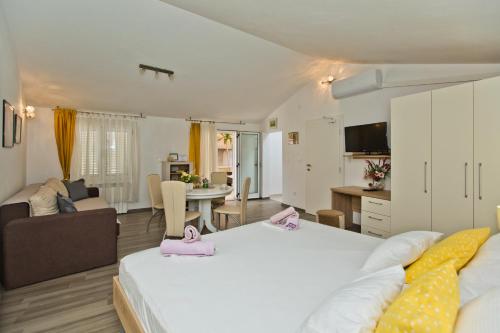Ένα ή περισσότερα κρεβάτια σε δωμάτιο στο Apartments Jure