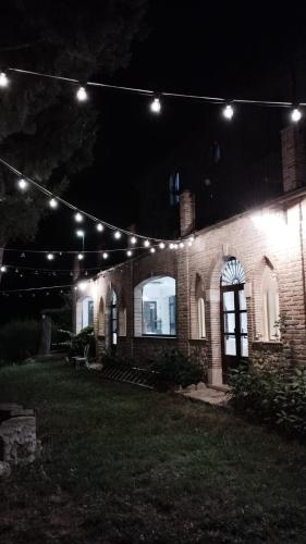 a house lit up at night with lights at Hotel Lo Smeraldo in Roccavivara