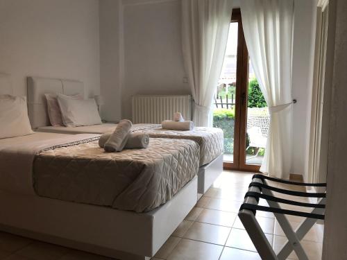 Postel nebo postele na pokoji v ubytování Amaryllis House