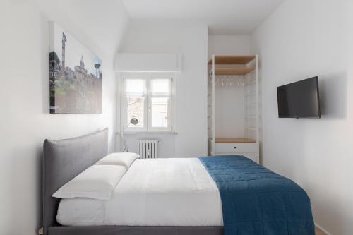 Кровать или кровати в номере Roman Residenza