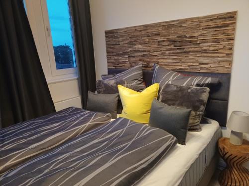 a bedroom with a bed and pillows at Bredeney View in Essen