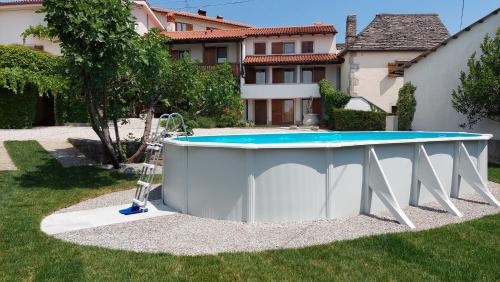 a pool in the yard of a house at Hiša Orel (Orel House) in Križ