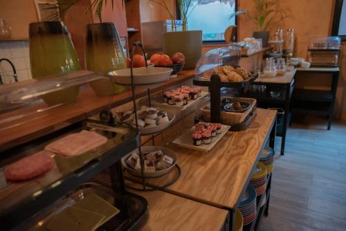a buffet line with different types of food on display at Simplon Hostel in Groningen