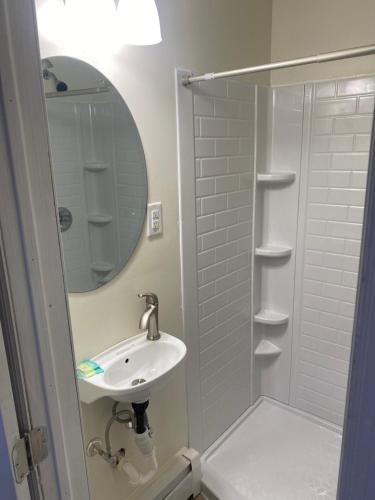 a bathroom with a sink and a mirror at Yankee Clipper Resort Motel in Wildwood Crest