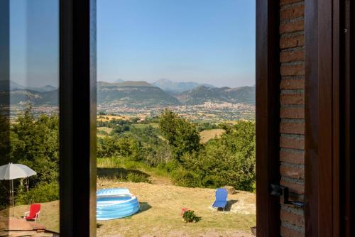 a window with a view of a mountain view at La Casa di Claudia in Gubbio
