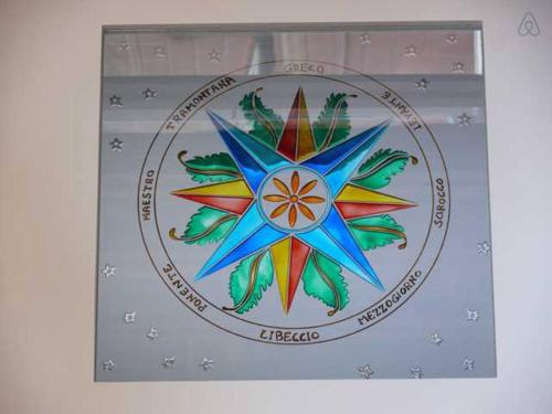 a picture of a mandala on a wall at B&B Portobello in Sestri Levante