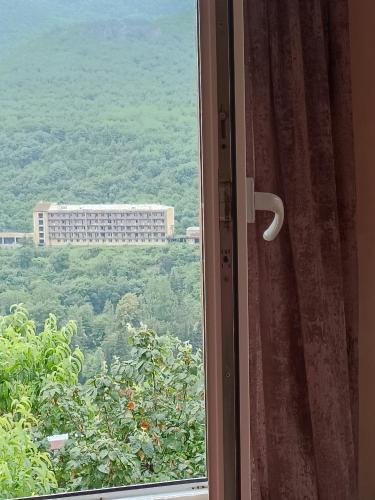 a window with a view of a building at Green Garden in Ijevan