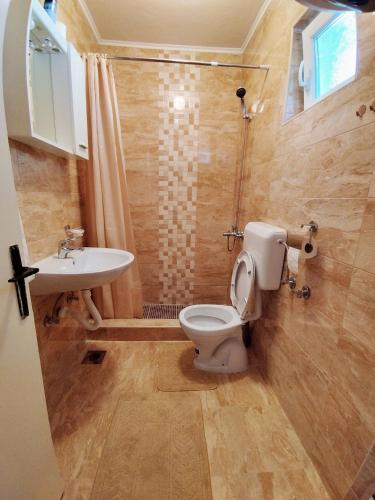 a bathroom with a toilet and a sink at Apartman Ss in Trebinje