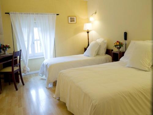 Ένα ή περισσότερα κρεβάτια σε δωμάτιο στο Hotel La Bougnate