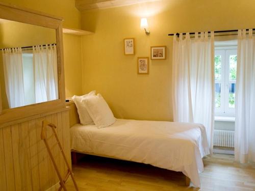 Ένα ή περισσότερα κρεβάτια σε δωμάτιο στο Hotel La Bougnate