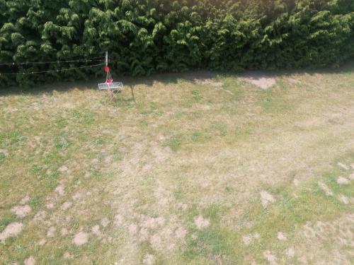 an aerial view of a yard with a red flag at Gästehaus an der Warnow in Schwaan