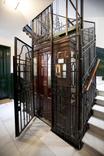 an entrance to a building with wrought iron gates at Hostal Santa Isabel in Madrid