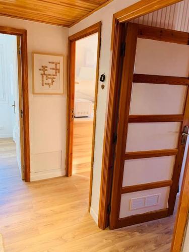 a room with a door and a room with a hallway at Valberg 8 couchages cocon familial in Guillaumes