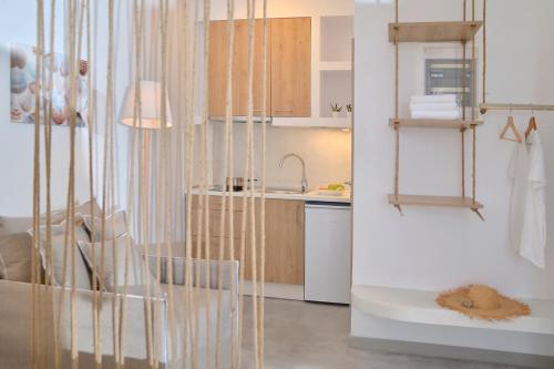 a small kitchen with a sink and a counter at Niriis Sea View Studio Melite Batsi in Batsi