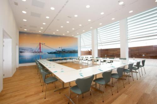 a large conference room with a long table and chairs at Hotel Hiberus in Zaragoza
