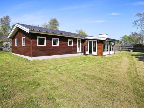 a house with a large yard in front of it at 6 person holiday home in Gilleleje-By Traum in Gilleleje