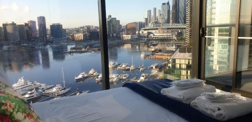 a hotel room with a large body of water at Melbourne Lifestyle Apartments – Best Views on Collins in Melbourne
