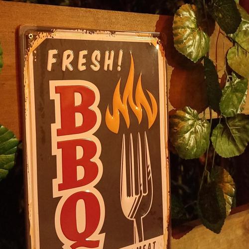 a sign that says fresh bbq with a fork at Compostela cabaña privada (private cabin for rent) in Jardin