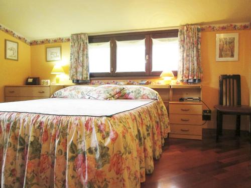 a bedroom with a bed and a window at B&B Piceno in Castel di Lama