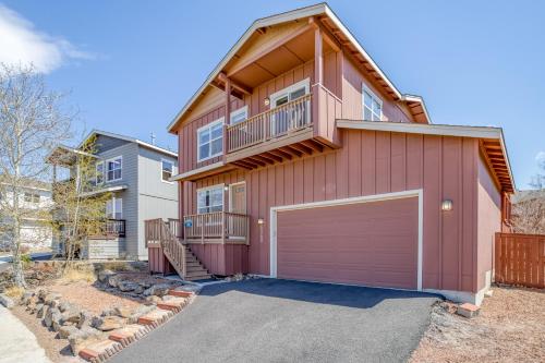 a large red house with a large garage at Hunters Circle - Meredith Lodging in Bend